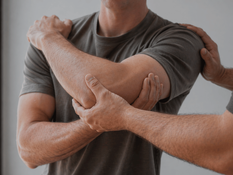 Male receiving an Osteopathic treatment for back pain